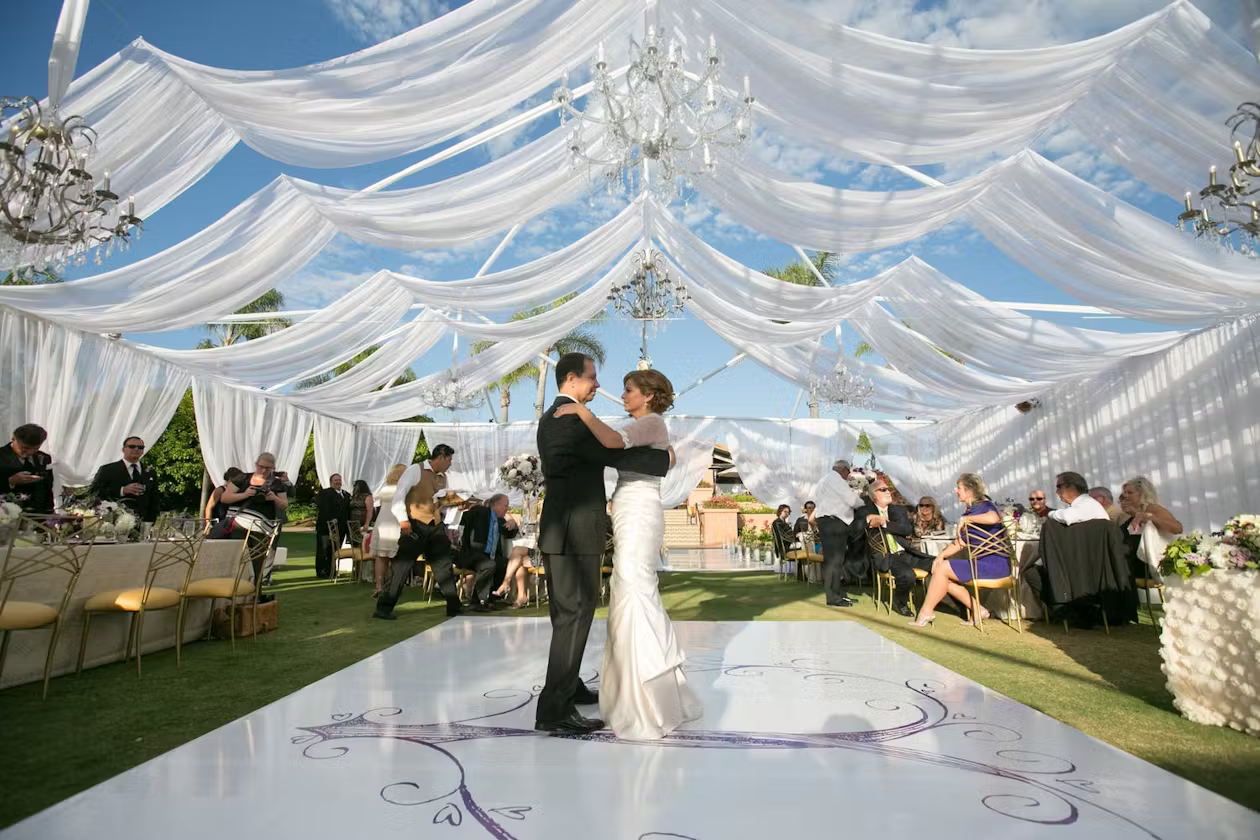 Panoramic shot of a decorated event venue with happy guests