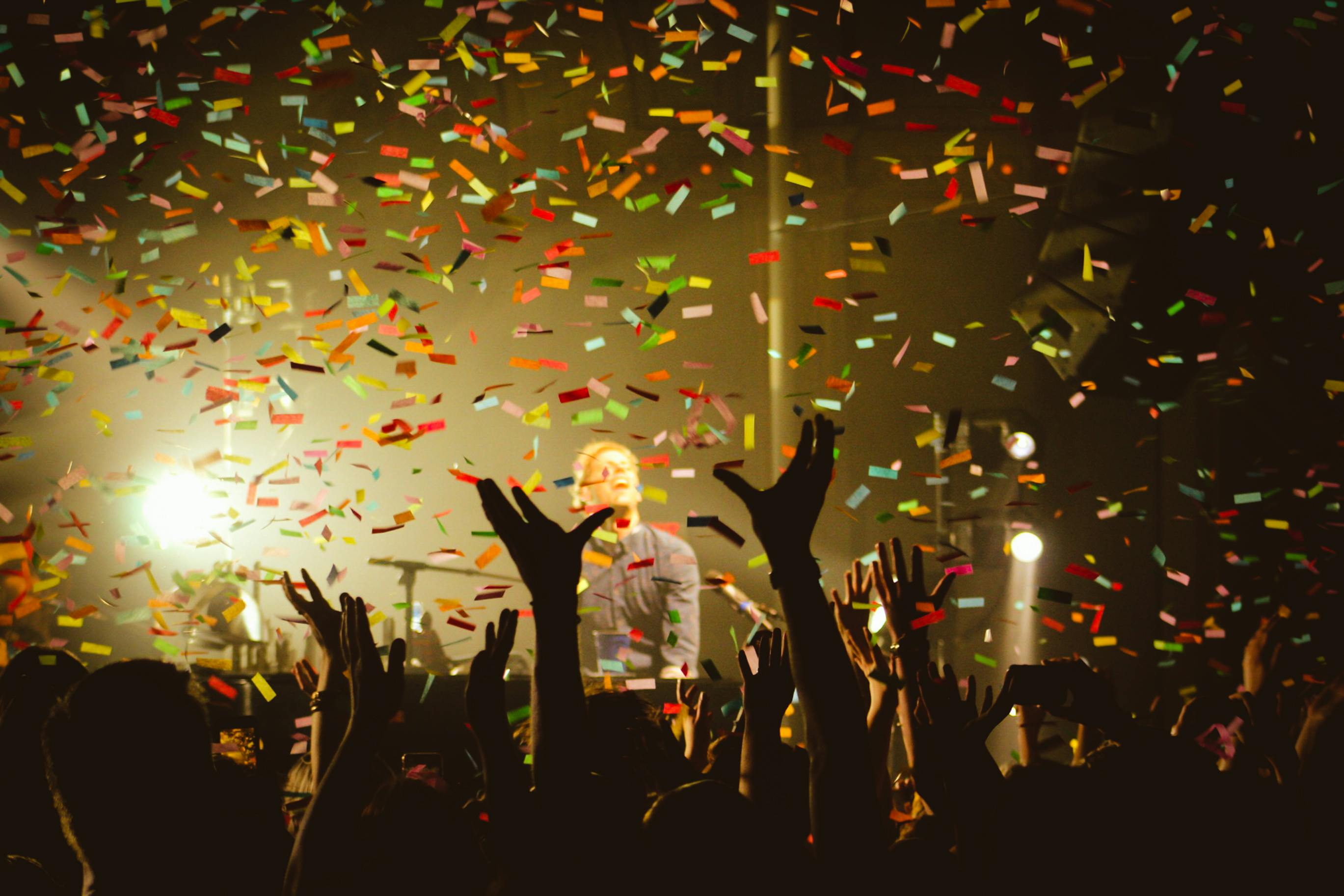 Guests cheering with confetti falling